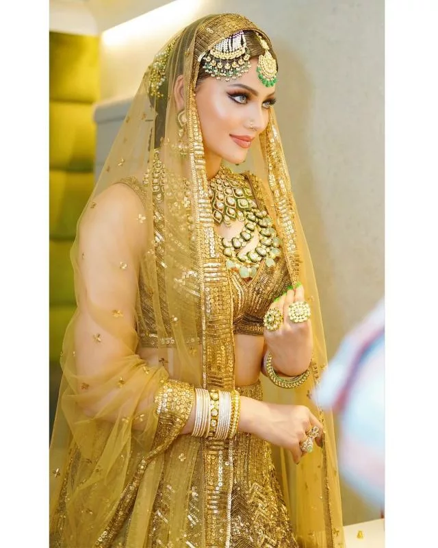 article 2023926815215855318000 Urvashi Rautela Done A Bridal Look, Stuns In A Golden-Hued Lehenga! with a hot look!