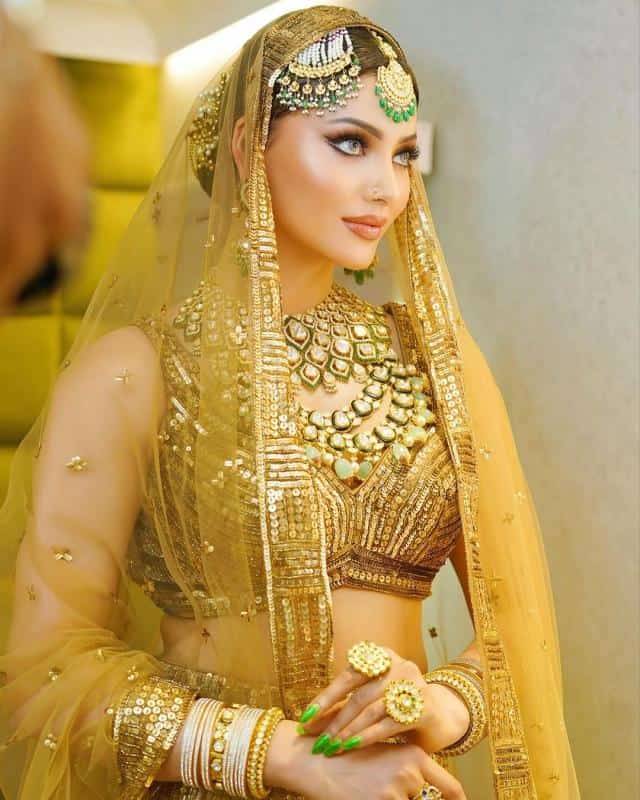 article 2023926815222555345000 Urvashi Rautela Done A Bridal Look, Stuns In A Golden-Hued Lehenga! with a hot look!