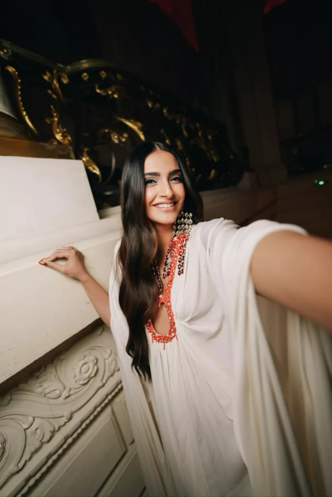 385729127 895638525251338 8362686429429121153 n Sonam Kapoor adds drama to her Valentino white kaftan dress with dangling rhinestone chandelier earrings