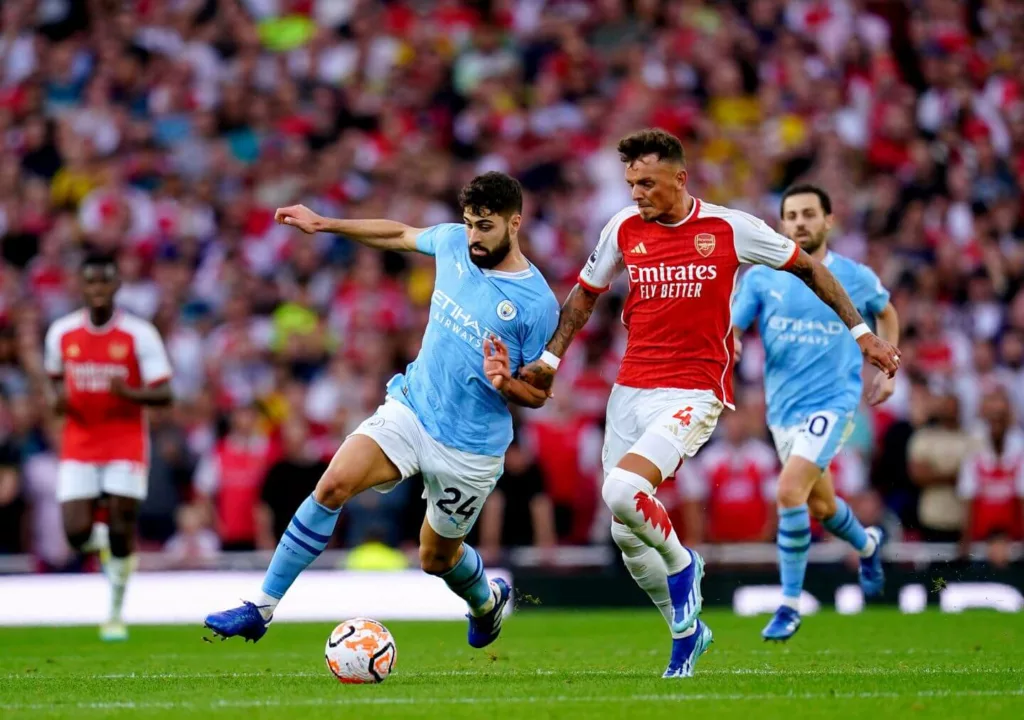 Arsenals Ben White in a tussle with Manchester Citys Josko Gvardiol Image via The Athletic Arsenal vs Manchester: Tactical Analysis on How Mikel Arteta Finally Beat Pep Guardiola
