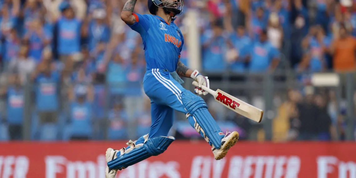 Cricket - ICC Cricket World Cup 2023 - Semi-Final - India v New Zealand - Wankhede Stadium, Mumbai, India - November 15, 2023 India's Virat Kohli celebrates after reaching his 50th century, breaking Sachin Tendulkar's record of most number of ODI centuries REUTERS/Adnan Abidi