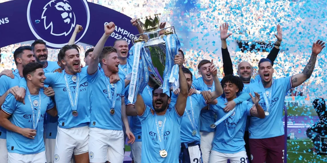 Soccer Football - Premier League - Manchester City v Chelsea - Etihad Stadium, Manchester, Britain - May 21, 2023 Manchester City's Ilkay Gundogan lifts the trophy as he celebrates with teammates after winning the Premier League Action Images via Reuters/Lee Smith