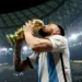 Soccer Football - FIFA World Cup Qatar 2022 - Final - Argentina v France - Lusail Stadium, Lusail, Qatar - December 18, 2022 Argentina's Lionel Messi kisses the trophy as he celebrates winning the World Cup REUTERS/Hannah Mckay
