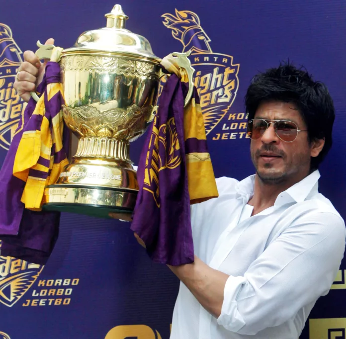 FILE PHOTO: Bollywood actor Shah Rukh Khan displays the IPL cricket trophy during a news conference at his residence in Mumbai IPL 2024 Auction LIVE Streaming & Broadcast: When and Where to Watch the Auction?