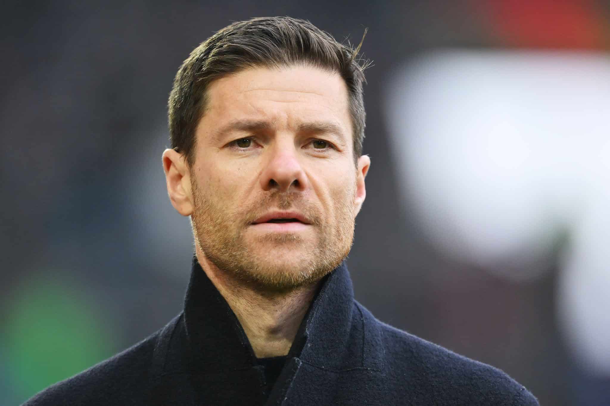 AUGSBURG, GERMANY - JANUARY 13: Xabi Alonso, Head Coach of Bayer Leverkusen, looks on prior to the Bundesliga match between FC Augsburg and Bayer 04 Leverkusen at WWK-Arena on January 13, 2024 in Augsburg, Germany. (Photo by Sebastian Widmann/Getty Images)