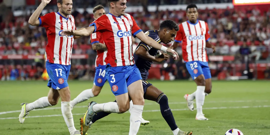 Soccer Football - LaLiga - Girona v Real Madrid - Estadi Montilivi, Girona, Spain - September 30, 2023 Real Madrid's Rodrygo in action with Girona's Miguel Gutierrez REUTERS/Albert Gea