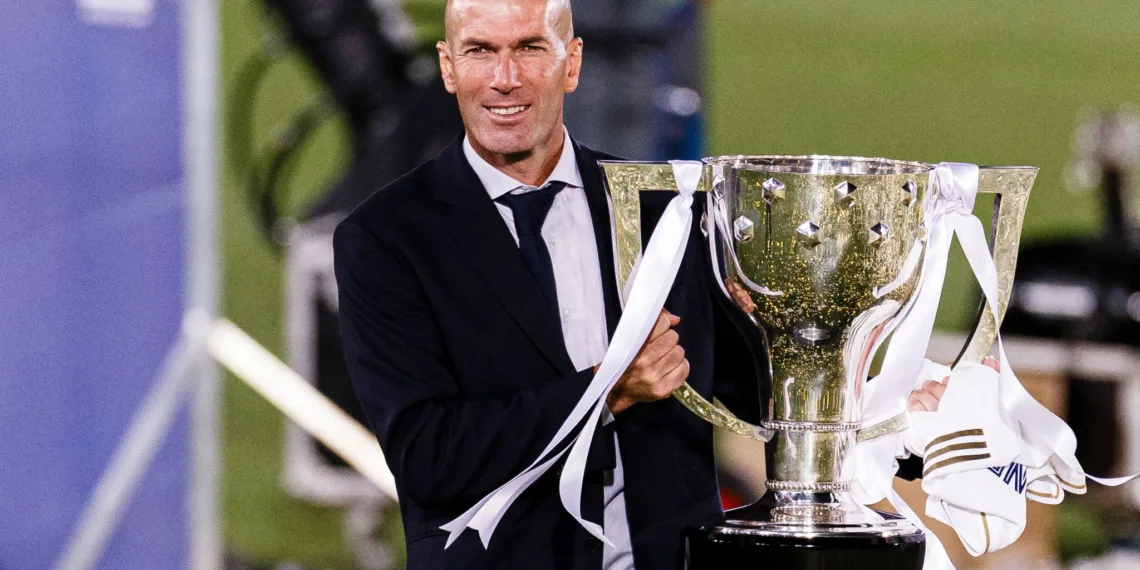 MADRID, SPAIN - JULY 16: Zinedine Zidane head coach of Real Madrid celebrates with the La Liga trophy after the La Liga match between Real Madrid CF and Villarreal CF at Estadio Alfredo Di Stefano on July 16, 2020 in Madrid, Spain. (Photo by Ricardo Nogueira/Eurasia Sport Images/Getty Images)