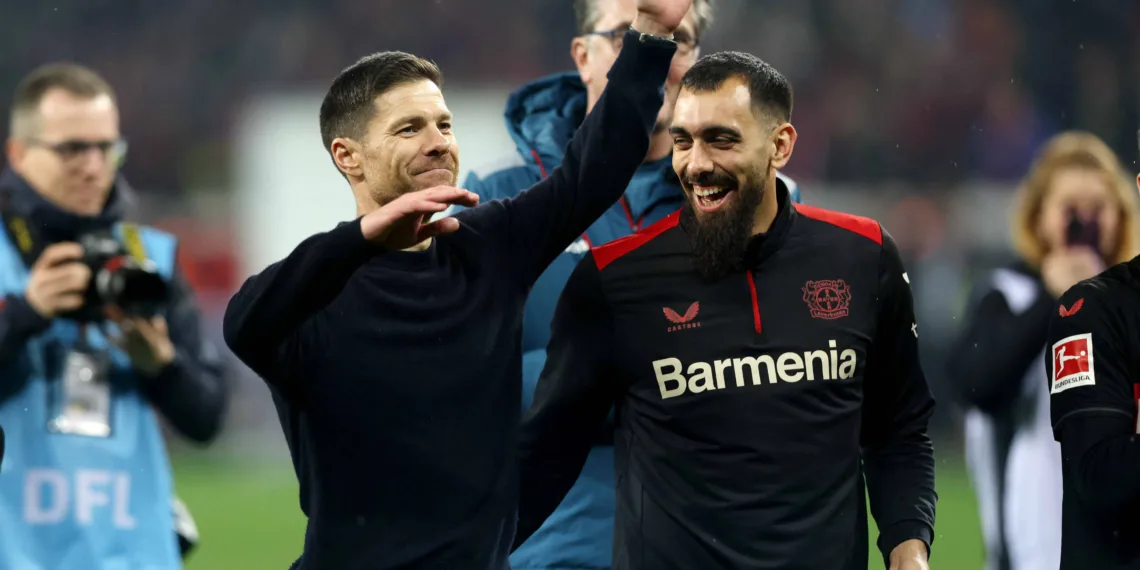 Soccer Football - Bundesliga - Bayer Leverkusen v Bayern Munich - BayArena, Leverkusen, Germany - February 10, 2024 Bayer Leverkusen coach Xabi Alonso celebrates with Borja Iglesias after the match REUTERS/Thilo Schmuelgen/ File Photo