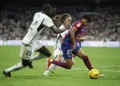 Soccer Football - LaLiga - Real Madrid v FC Barcelona - Santiago Bernabeu, Madrid, Spain - April 21, 2024 FC Barcelona's Lamine Yamal in action with Real Madrid's Antonio Rudiger and Luka Modric REUTERS/Juan Medina