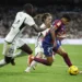 Soccer Football - LaLiga - Real Madrid v FC Barcelona - Santiago Bernabeu, Madrid, Spain - April 21, 2024 FC Barcelona's Lamine Yamal in action with Real Madrid's Antonio Rudiger and Luka Modric REUTERS/Juan Medina