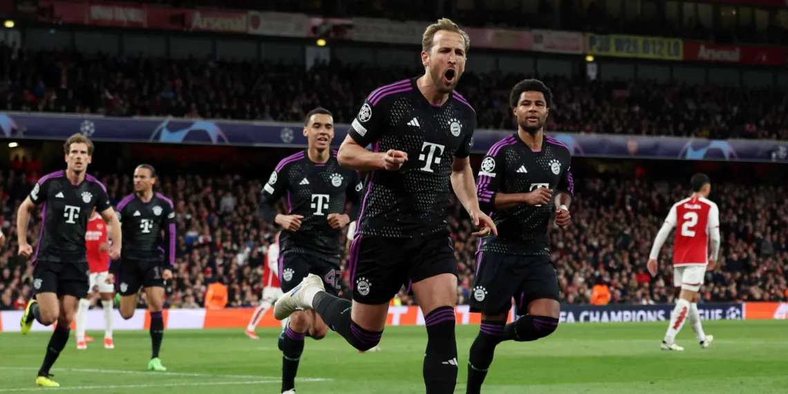Soccer Football - Champions League - Quarter Final - First Leg - Arsenal v Bayern Munich - Emirates Stadium, London, Britain - April 9, 2024 Bayern Munich's Harry Kane celebrates scoring their second goal with Jamal Musiala and Serge Gnabry REUTERS/David Klein