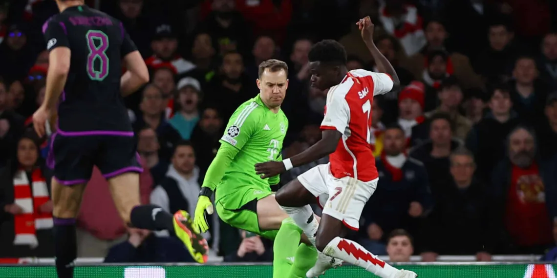 Soccer Football - Champions League - Quarter Final - First Leg - Arsenal v Bayern Munich - Emirates Stadium, London, Britain - April 9, 2024 Bayern Munich's Manuel Neuer in action with Arsenal's Bukayo Saka Action Images via Reuters/Matthew Childs