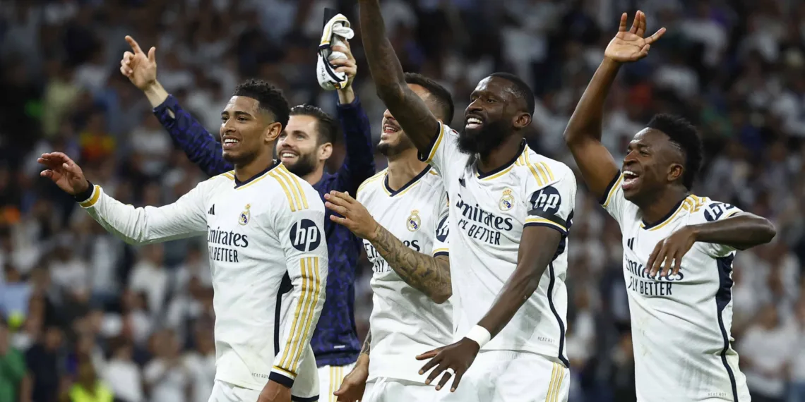 Soccer Football - LaLiga - Real Madrid v FC Barcelona - Santiago Bernabeu, Madrid, Spain - April 21, 2024 Real Madrid's Jude Bellingham, Antonio Rudiger and Vinicius Junior celebrate after the match REUTERS/Susana Vera