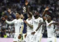Soccer Football - LaLiga - Real Madrid v FC Barcelona - Santiago Bernabeu, Madrid, Spain - April 21, 2024 Real Madrid's Jude Bellingham, Antonio Rudiger and Vinicius Junior celebrate after the match REUTERS/Susana Vera