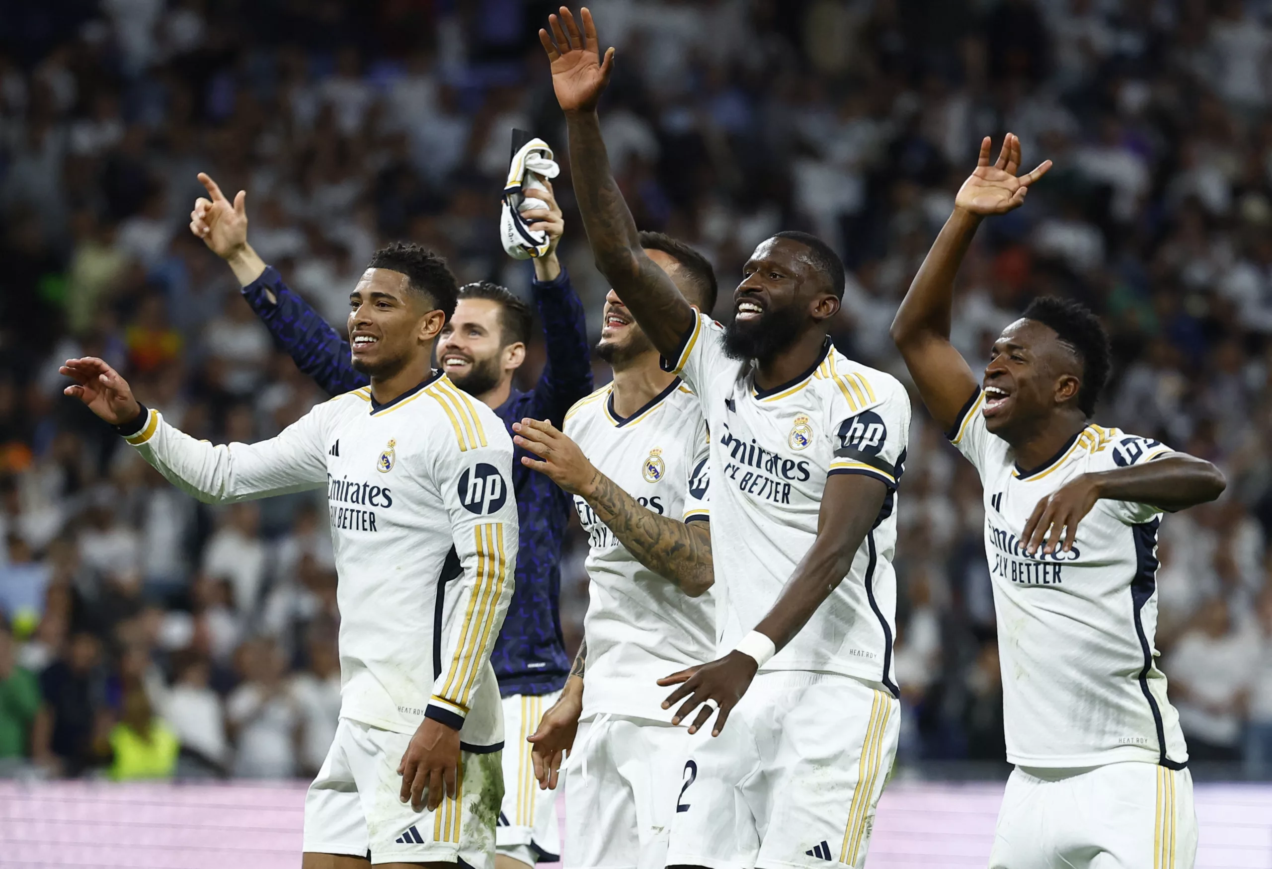 Soccer Football - LaLiga - Real Madrid v FC Barcelona - Santiago Bernabeu, Madrid, Spain - April 21, 2024 Real Madrid's Jude Bellingham, Antonio Rudiger and Vinicius Junior celebrate after the match REUTERS/Susana Vera