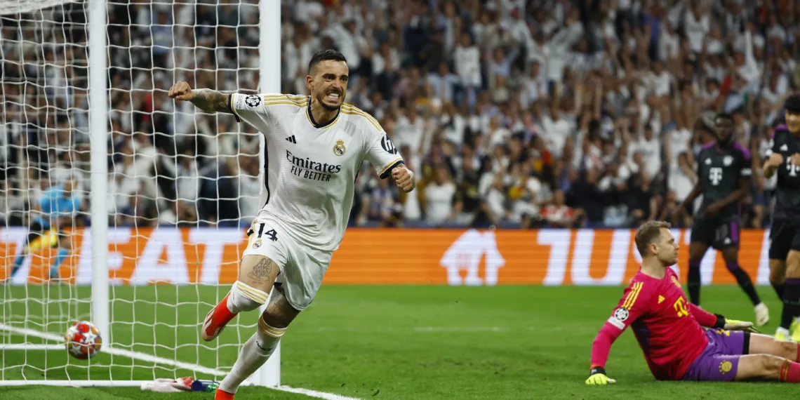 Soccer Football - Champions League - Semi Final - Second Leg - Real Madrid v Bayern Munich - Santiago Bernabeu, Madrid, Spain - May 8, 2024 Real Madrid's Joselu celebrates scoring their first goal as Bayern Munich's Manuel Neuer looks dejected REUTERS/Susana Vera