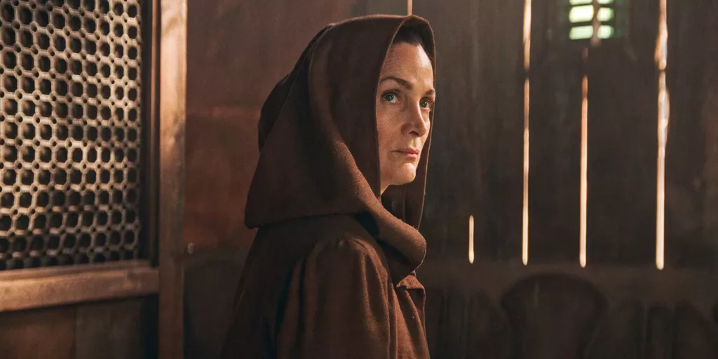 Carrie Anne Moss in The Acolyte Image Credits Disney A Jedi Assassin Lurks in ‘The Acolyte’ Trailer As It's Existence Is Threatened: New ‘Star Wars’ Series Unfolds a Century Before the Prequels