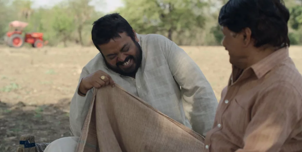 Prahlad ji smiling in a scene from Panchyat season 3 trailer Image Credits Prime Video India Panchayat Season 3 Trailer: Bidhayak Ji Catches On The Election Fever As Well Streaming On Prime Video