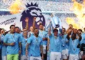 Soccer Football - Premier League - Manchester City v West Ham United - Etihad Stadium, Manchester, Britain - May 19, 2024  Manchester City's Kevin De Bruyne and teammates celebrate with the trophy after winning the Premier League REUTERS/Molly Darlington