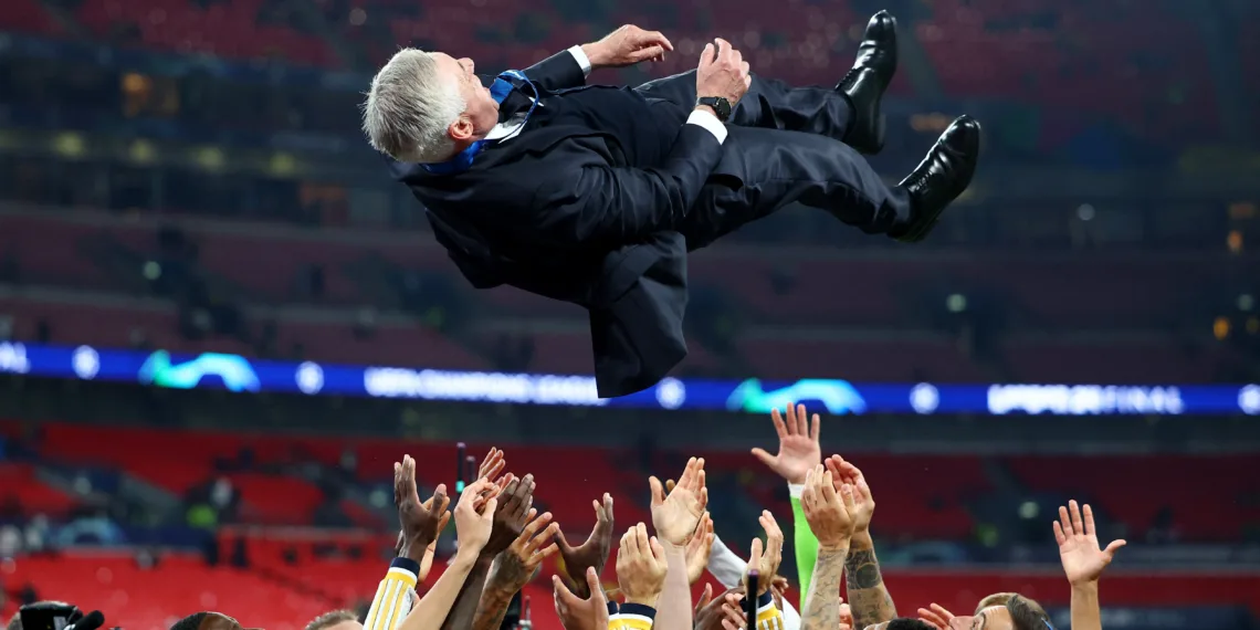 Soccer Football - Champions League - Final - Borussia Dortmund v Real Madrid - Wembley Stadium, London, Britain - June 1, 2024 Real Madrid players throw coach Carlo Ancelotti in the air as they celebrate after winning the Champions League final REUTERS/Hannah Mckay