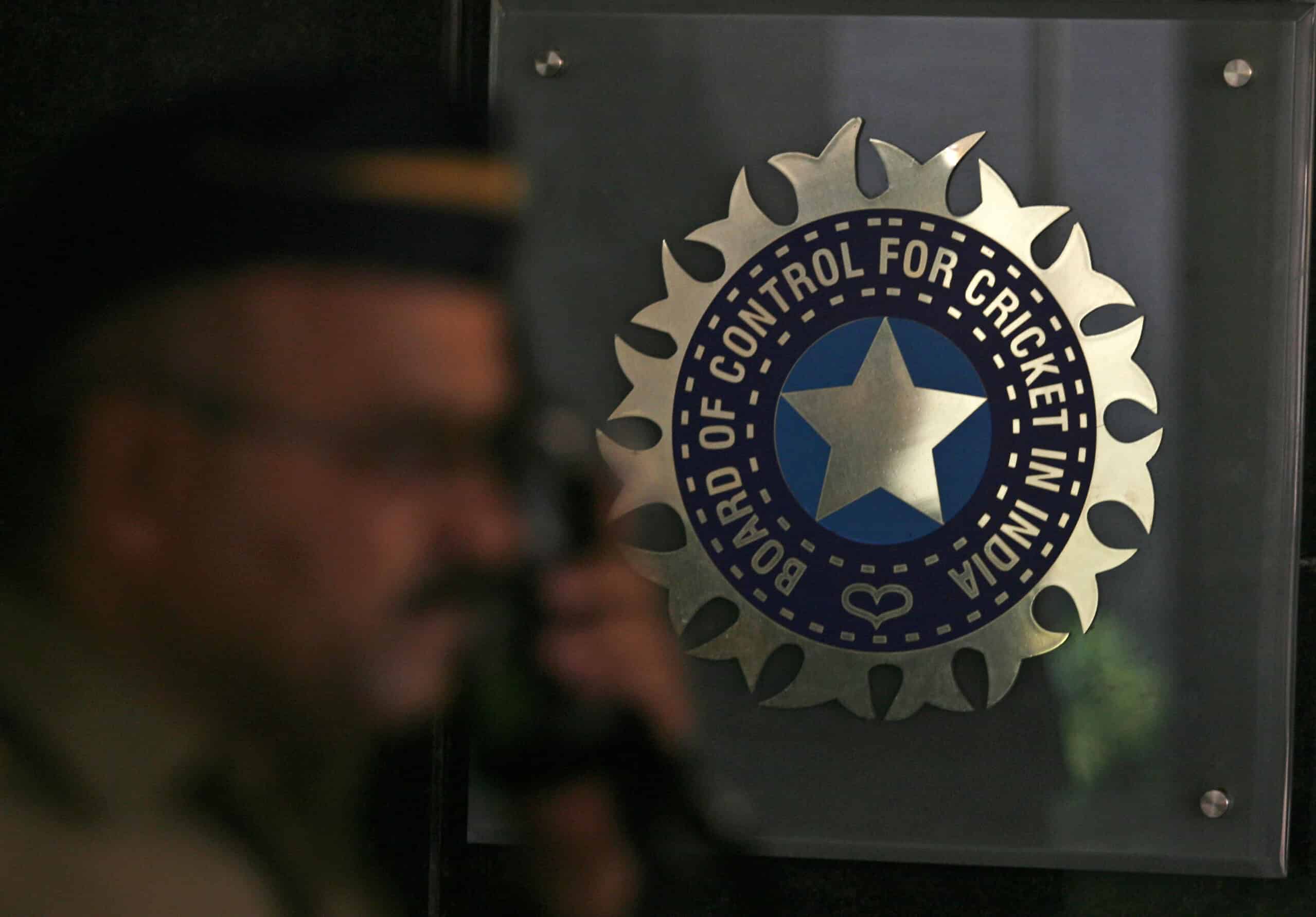 A policeman walks past a logo of the Board of Control for Cricket in India (BCCI) during a governing council meeting of the Indian Premier League (IPL) at BCCI headquarters in Mumbai April 26, 2010. Indian Premier League chief Lalit Modi has been suspended, officials said on Monday, after graft accusations in cricket's richest event ensnared top politicians and Bollywood stars and strained the ruling coalition.  REUTERS/Arko Datta (INDIA - Tags: SPORT CRICKET)