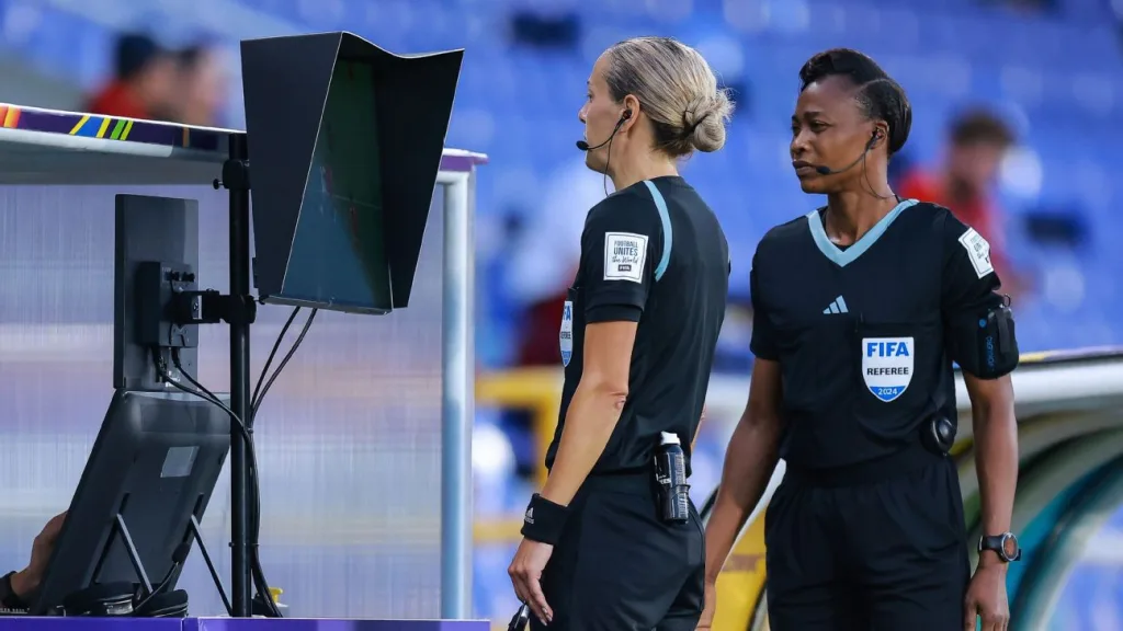 Referee Ivana Martincic reviews an incident after a challenge made by a coach during the FIFA U20 Womens World Cup semifinal between United States and North Korea in Cali Colombia FIFA Aims to Broaden Trials of FVS: A VAR-Style Coach Challenge System