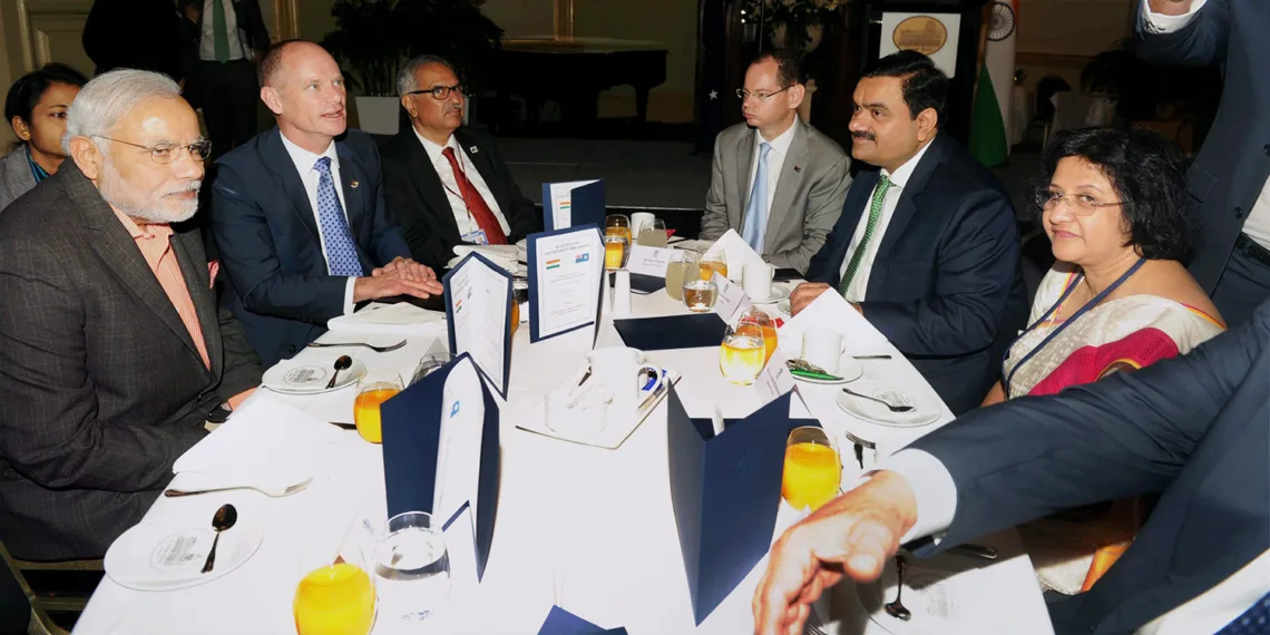 Brisbane: Prime Minister Narendra Modi addresses a business breakfast hosted by the Premier of Queensland, Campbell Newman in Brisbane, Australia on Monday. Industrialist Gautam Adani is also seen. PTI Photo (PTI11_17_2014_000050B)