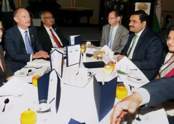 Brisbane: Prime Minister Narendra Modi addresses a business breakfast hosted by the Premier of Queensland, Campbell Newman in Brisbane, Australia on Monday. Industrialist Gautam Adani is also seen. PTI Photo (PTI11_17_2014_000050B)