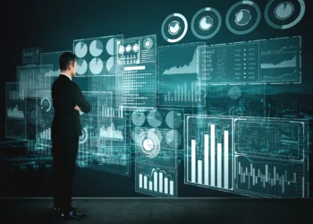 Big Data Technology for Business Finance Analytic Concept. Modern graphic interface shows massive information of business sale report, profit chart and stock market trends analysis on screen monitor.