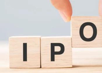 IPO (Initial Public Offering) word with wooden cube block, shares of a private corporation to the public in a new stock issuance. Stock, Fund, Investors and Investment concept