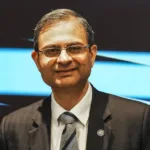 Bajaj Finance, SBI Cards Rally 4% as RBI Governor Says Unsecured Loan Stress Has Abated