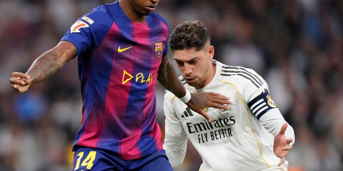 Marcus Rashford left winger of Barcelona and England and Federico Valverde central midfield of Real Madrid and Uruguay compete for the ball during the La Liga EA Sports match between Real Madrid CF and FC Barcelona at Estadio Santiago Bernabeu on October 26, 2025 in Madrid, Spain. (Photo by Jose Breton/Pics Action/NurPhoto via Getty Images)