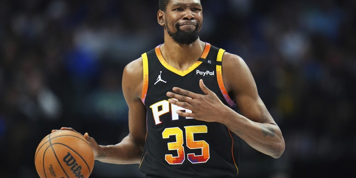 FILE - Phoenix Suns forward Kevin Durant gestures during the second half of an NBA basketball game on March 9, 2025, in Dallas. (AP Photo/Julio Cortez, File)