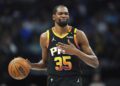 FILE - Phoenix Suns forward Kevin Durant gestures during the second half of an NBA basketball game on March 9, 2025, in Dallas. (AP Photo/Julio Cortez, File)