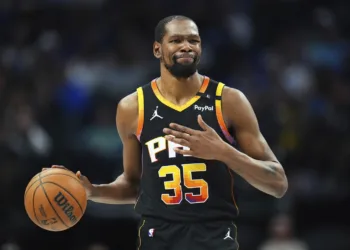 FILE - Phoenix Suns forward Kevin Durant gestures during the second half of an NBA basketball game on March 9, 2025, in Dallas. (AP Photo/Julio Cortez, File)