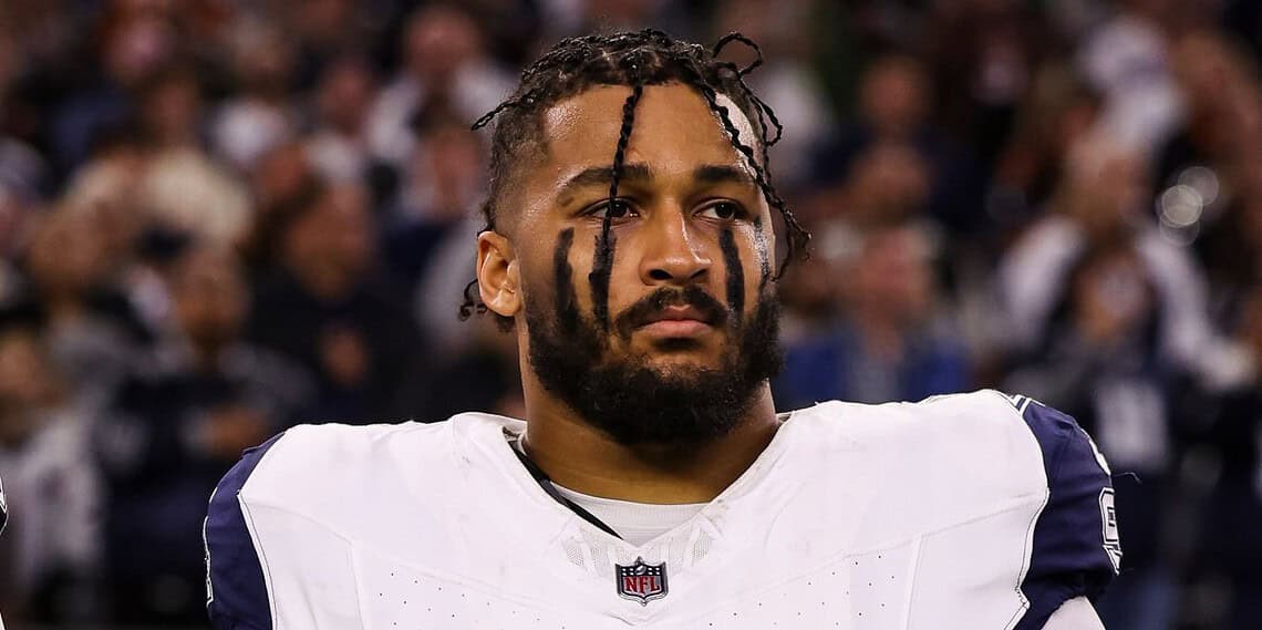 ARLINGTON, TEXAS - DECEMBER 09: Marshawn Kneeland #94 of the Dallas Cowboys looks on from the sideline during the national anthem prior to an NFL football game against the Cincinnati Bengals at AT&T Stadium on December 9, 2024 in Arlington, Texas. (Photo by Perry Knotts/Getty Images)