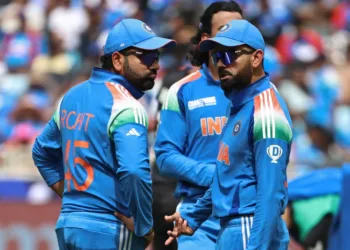 India's Virat Kohli (R) speaks with his team captain Rohit Sharma while taking a break during the ICC Champions Trophy one-day international (ODI) final cricket match between India and New Zealand at the Dubai International Stadium in Dubai on March 9, 2025. (Photo by FADEL SENNA / AFP) (Photo by FADEL SENNA/AFP via Getty Images)