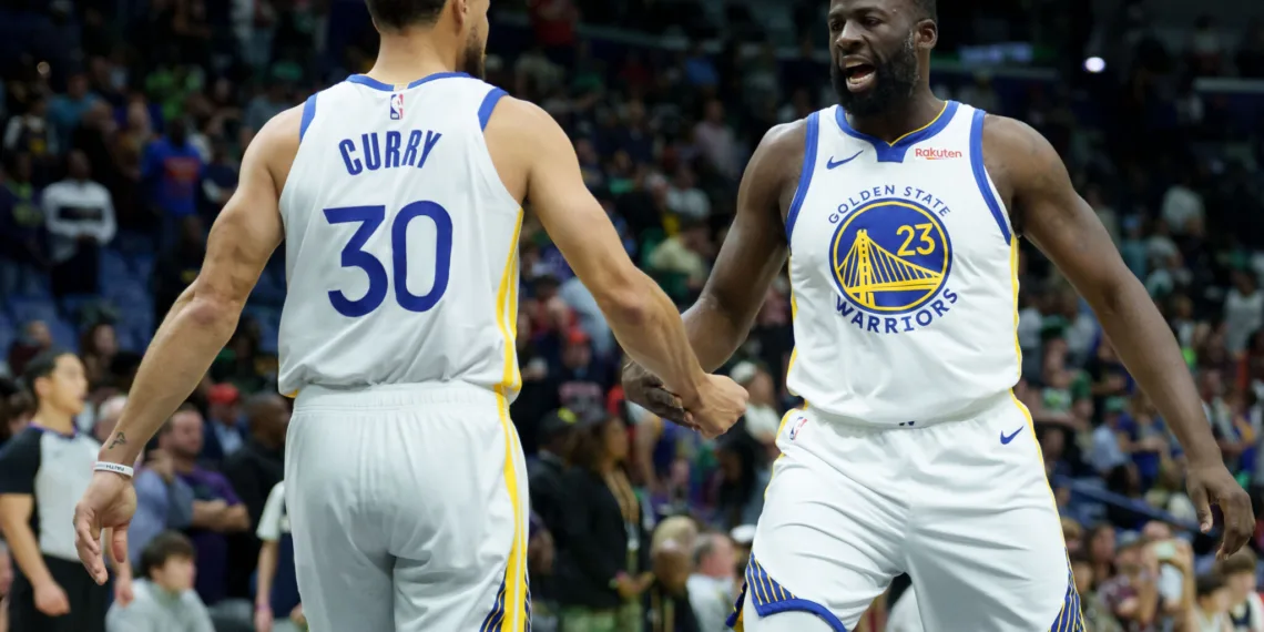 Nov 16, 2025; New Orleans, Louisiana, USA; Golden State Warriors forward Draymond Green (23) celebrates with guard Stephen Curry (30) during the first half against the New Orleans Pelicans at Smoothie King Center. Mandatory Credit: Matthew Hinton-Imagn Images