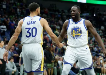 Nov 16, 2025; New Orleans, Louisiana, USA; Golden State Warriors forward Draymond Green (23) celebrates with guard Stephen Curry (30) during the first half against the New Orleans Pelicans at Smoothie King Center. Mandatory Credit: Matthew Hinton-Imagn Images