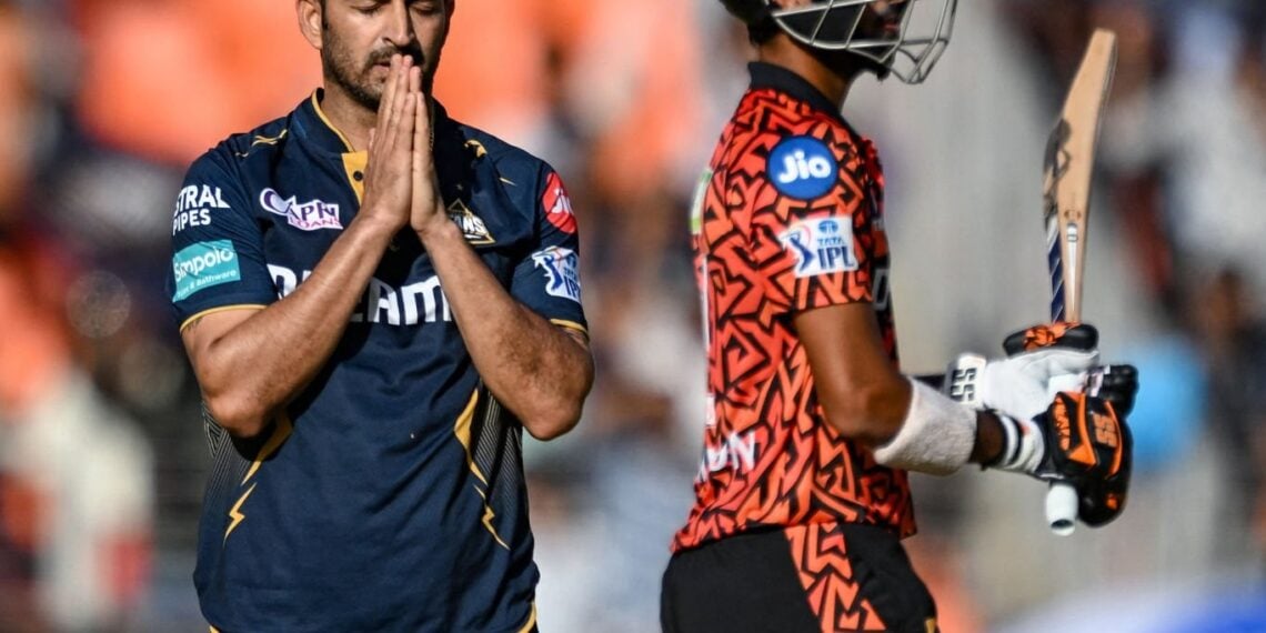 Gujarat Titans' Mohit Sharma celebrates after taking the wicket of Sunrisers Hyderabad's Washington Sundar (R) during the Indian Premier League (IPL) Twenty20 cricket match between Gujarat Titans and Sunrisers Hyderabad at the Narendra Modi Stadium in Ahmedabad on March 31, 2024. (Photo by Sajjad HUSSAIN / AFP) / -- IMAGE RESTRICTED TO EDITORIAL USE - STRICTLY NO COMMERCIAL USE -- (Photo by SAJJAD HUSSAIN/AFP via Getty Images)