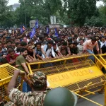 Delhi Standoff: Thousands Rally Against Exam Leak Scandal as Police Hold the Line