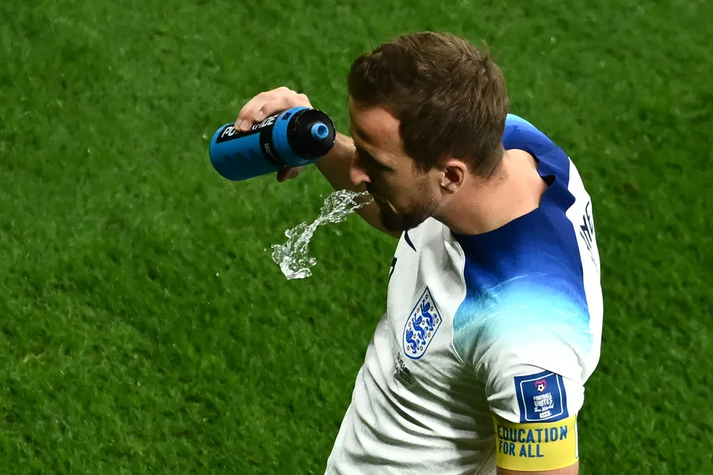 Why Do Footballers Spit Out Water Instead of Drinking It During a Match?