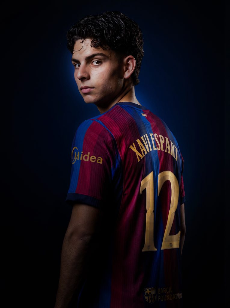 Xavi Espart signs his Barcelona contract, pictured near his rapid rise under Hansi Flick